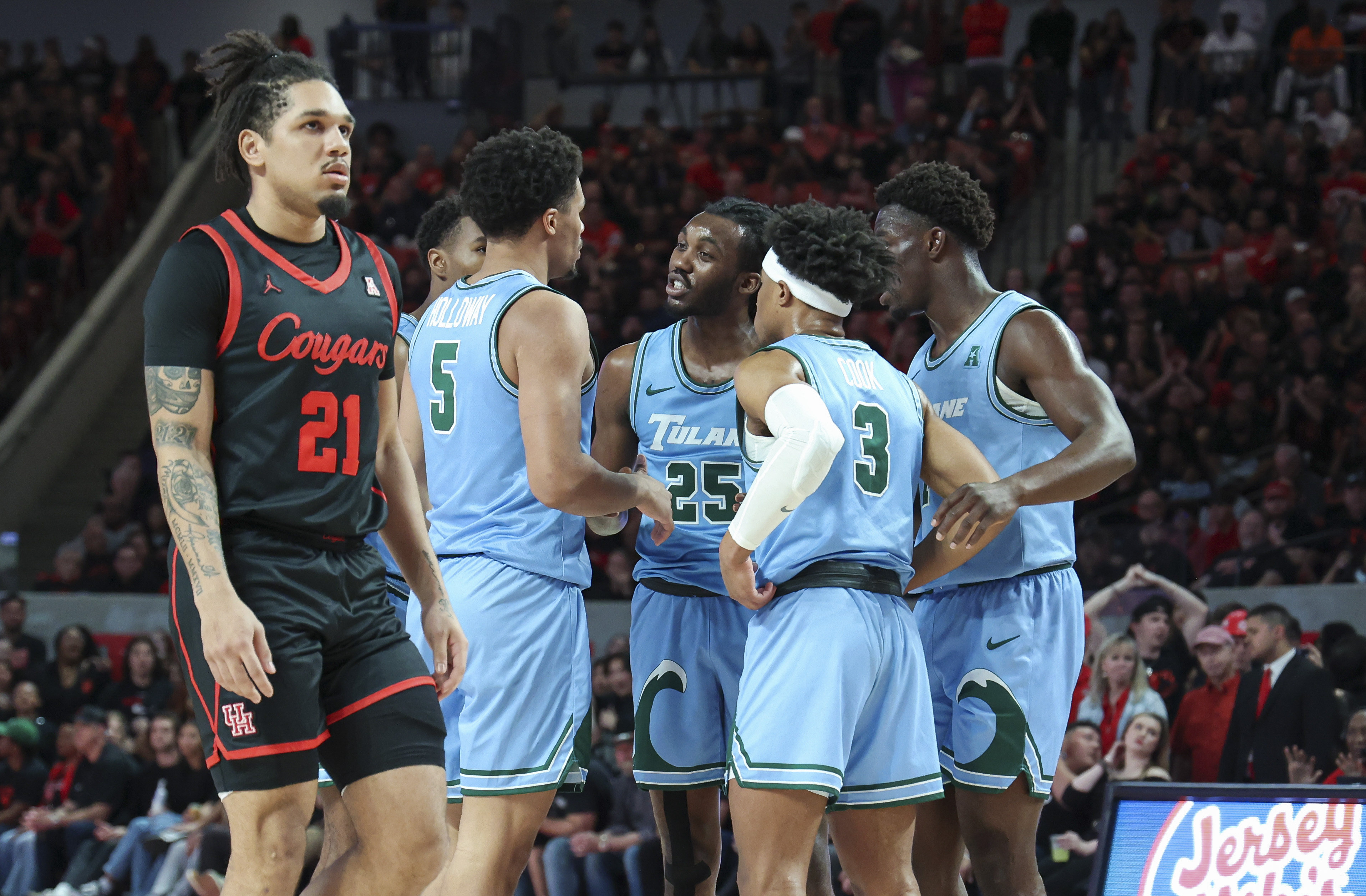 eb 22, 2023; Houston, Texas, USA; Tulane Green Wave guard Jaylen Forbes (25) talks with teammates after a play during the first half against the Houston Cougars at Fertitta Center.
